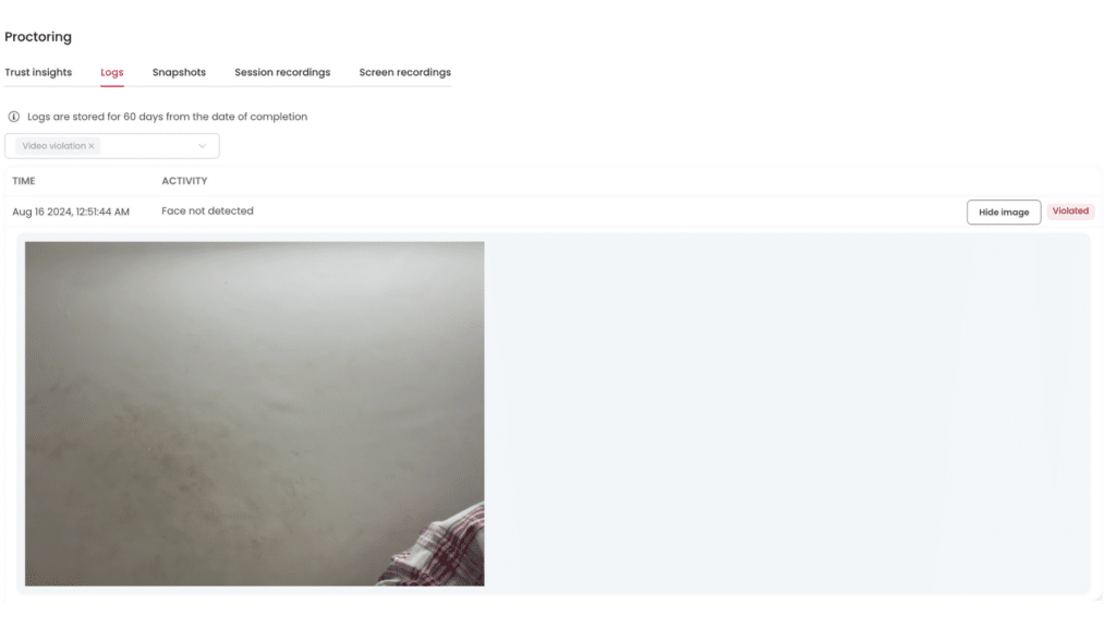 Screenshot of an AI-proctoring log showing a “Face not detected” alert and an image where the test-taker’s face is out of frame.