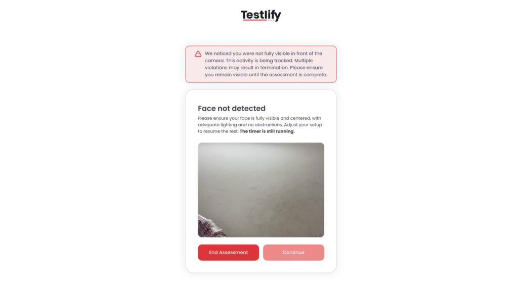On-screen warning when the candidate is out of frame while giving a test through Testlify.